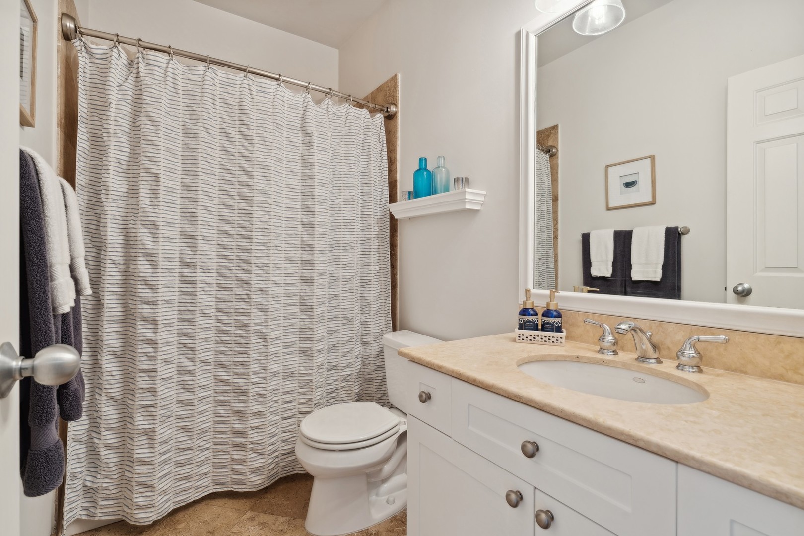 2147 West Rice Street, Unit 1W Chicago, IL 60622 - Photo 16 of 27 a bathroom with a granite countertop sink toilet and shower