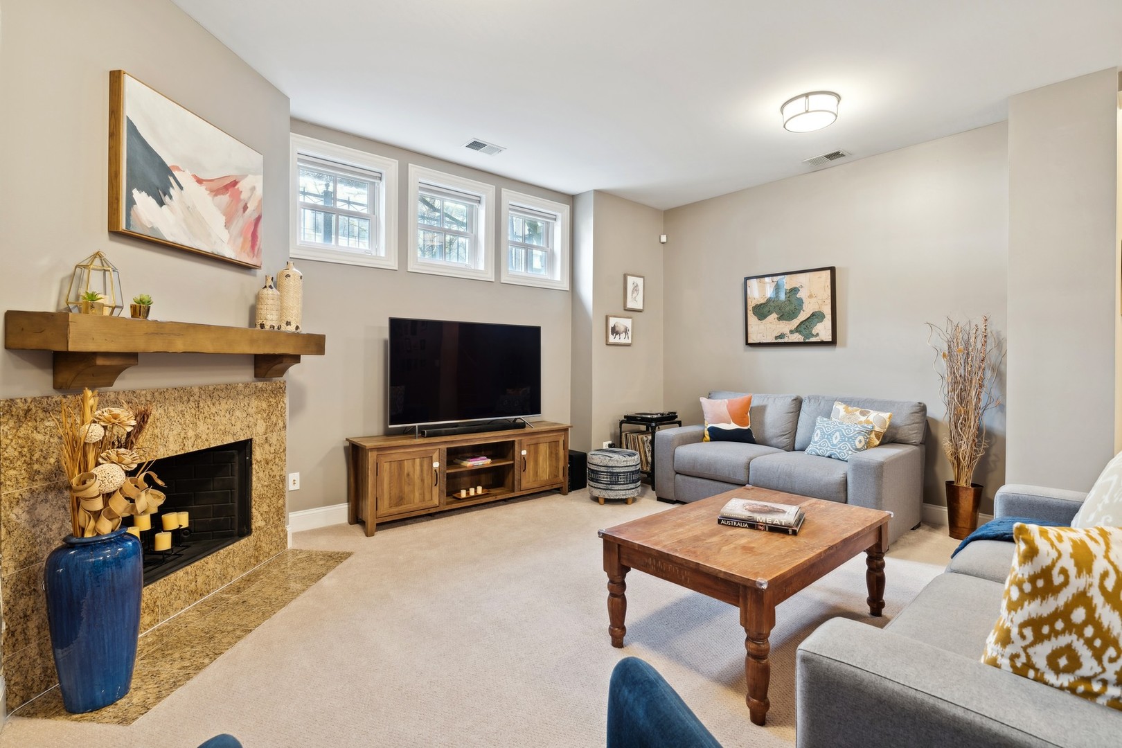2147 West Rice Street, Unit 1W Chicago, IL 60622 - Photo 17 of 27 a living room with furniture a flat screen tv and a fireplace