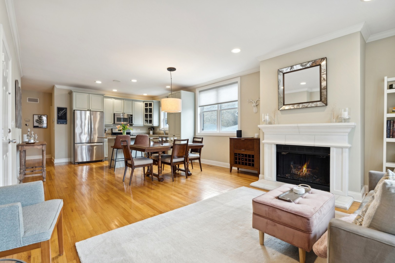 2147 West Rice Street, Unit 1W Chicago, IL 60622 - Photo 5 of 27 a living room with furniture kitchen view and a fireplace