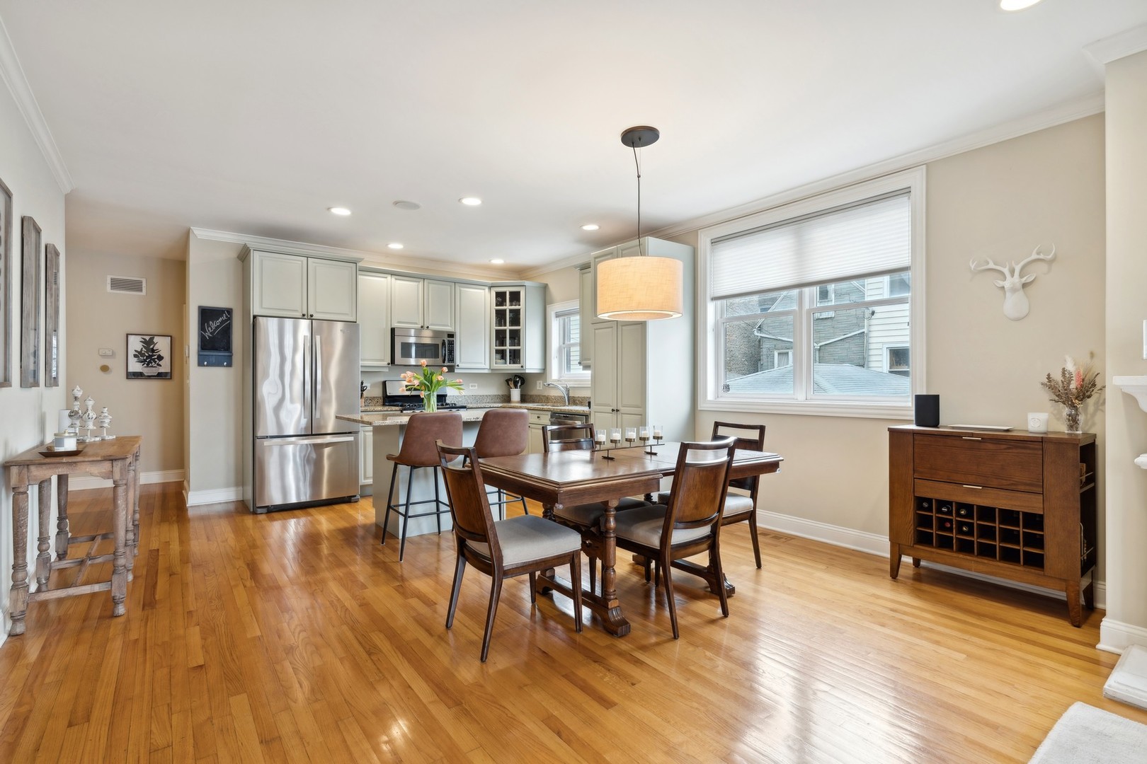 2147 West Rice Street, Unit 1W Chicago, IL 60622 - Photo 7 of 27 a view of a dining room with furniture window and wooden floor