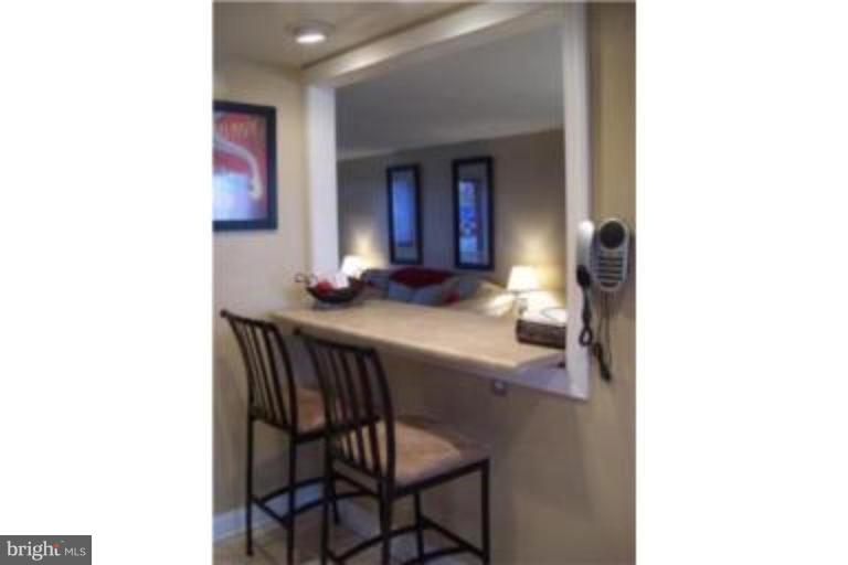 1363 Kenton Road Parkville, MD 21234 - Photo 4 of 9 a hallway with a table and chairs