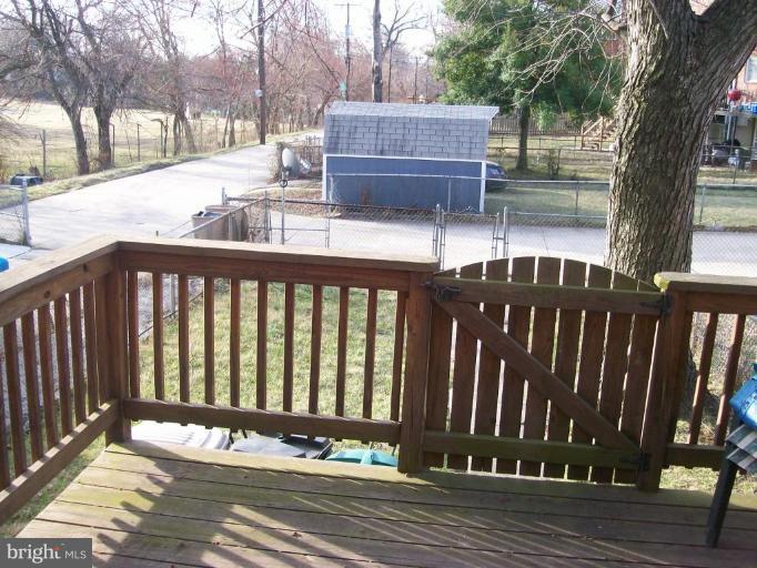 1363 Kenton Road Parkville, MD 21234 - Photo 8 of 9 a view of a wooden deck and a yard