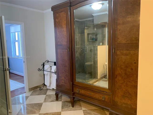 a bathroom with a glass shower door