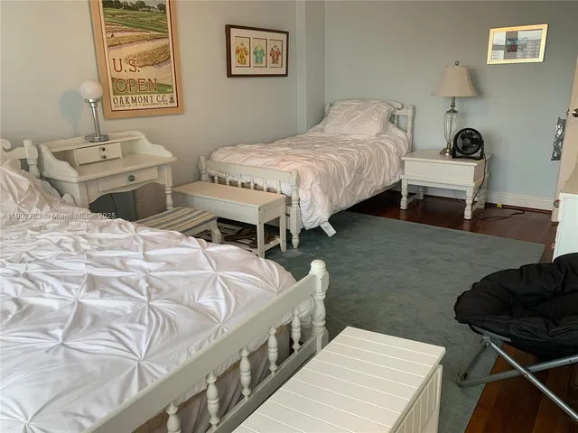 a bedroom with bed and a couch