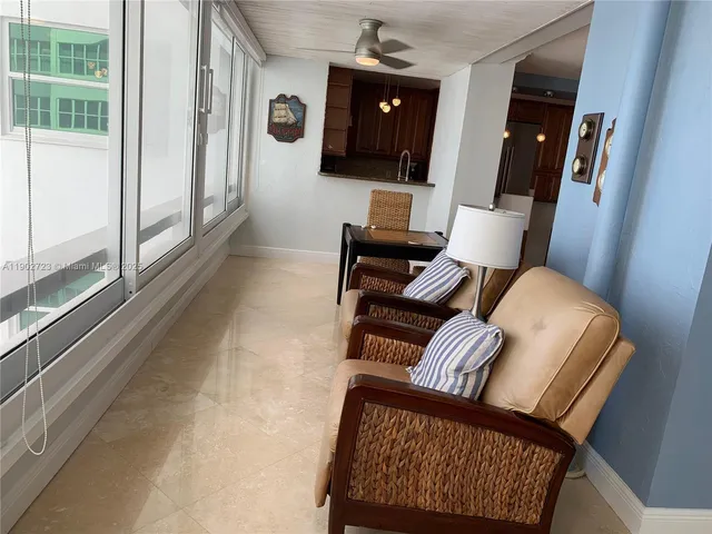 a view of living room with furniture and wooden floor