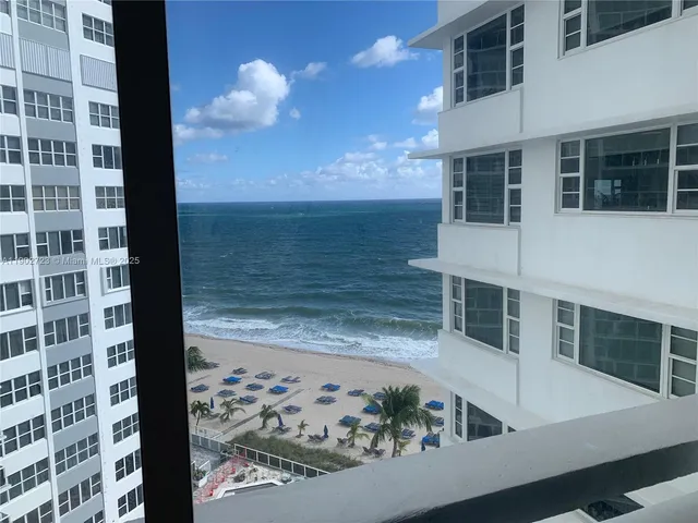 a view of a balcony with potted plants