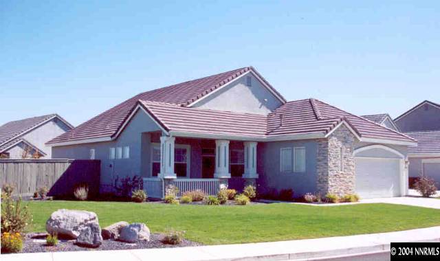 1601 Dutch Ravine Court Reno, NV 89521 - Photo 1 of 9 a front view of a house with a garden and yard