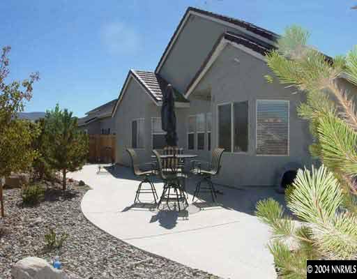 1601 Dutch Ravine Court Reno, NV 89521 - Photo 2 of 9 a view of a patio with couches table and chairs and potted plants