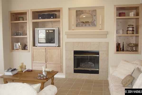 1601 Dutch Ravine Court Reno, NV 89521 - Photo 3 of 9 a living room with furniture and a fireplace