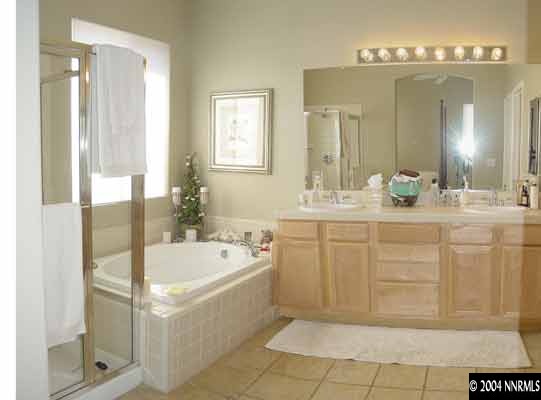 1601 Dutch Ravine Court Reno, NV 89521 - Photo 6 of 9 a bathroom with a tub sink and mirror