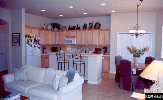1601 Dutch Ravine Court Reno, NV 89521 - Photo 7 of 9 a living room with furniture and a chandelier