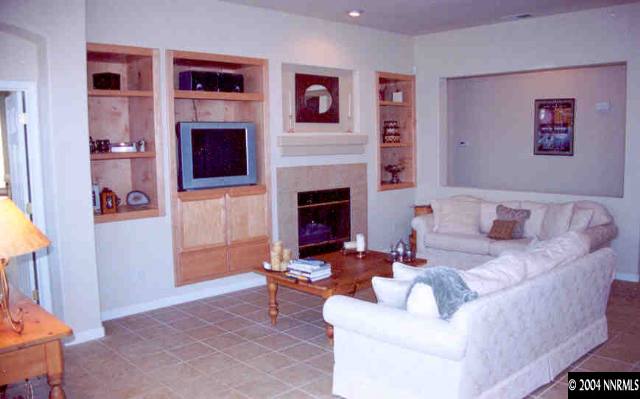 1601 Dutch Ravine Court Reno, NV 89521 - Photo 8 of 9 a living room with furniture fireplace and window