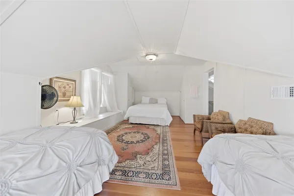 a bedroom with double bed and a window