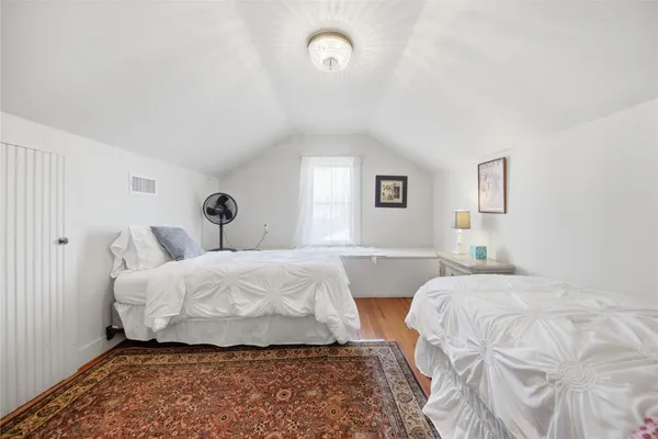 a bedroom with a bed and a table in it