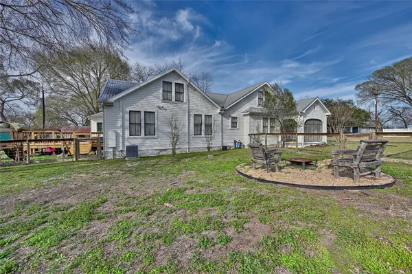 a front view of a house with a yard and porch