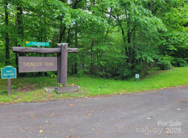 a sign board with a yard