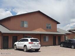 1203 East Main Street, Unit 200'S AND 300'S Springerville, AZ 85938 - Photo 1 of 1 a car parked in front of a building