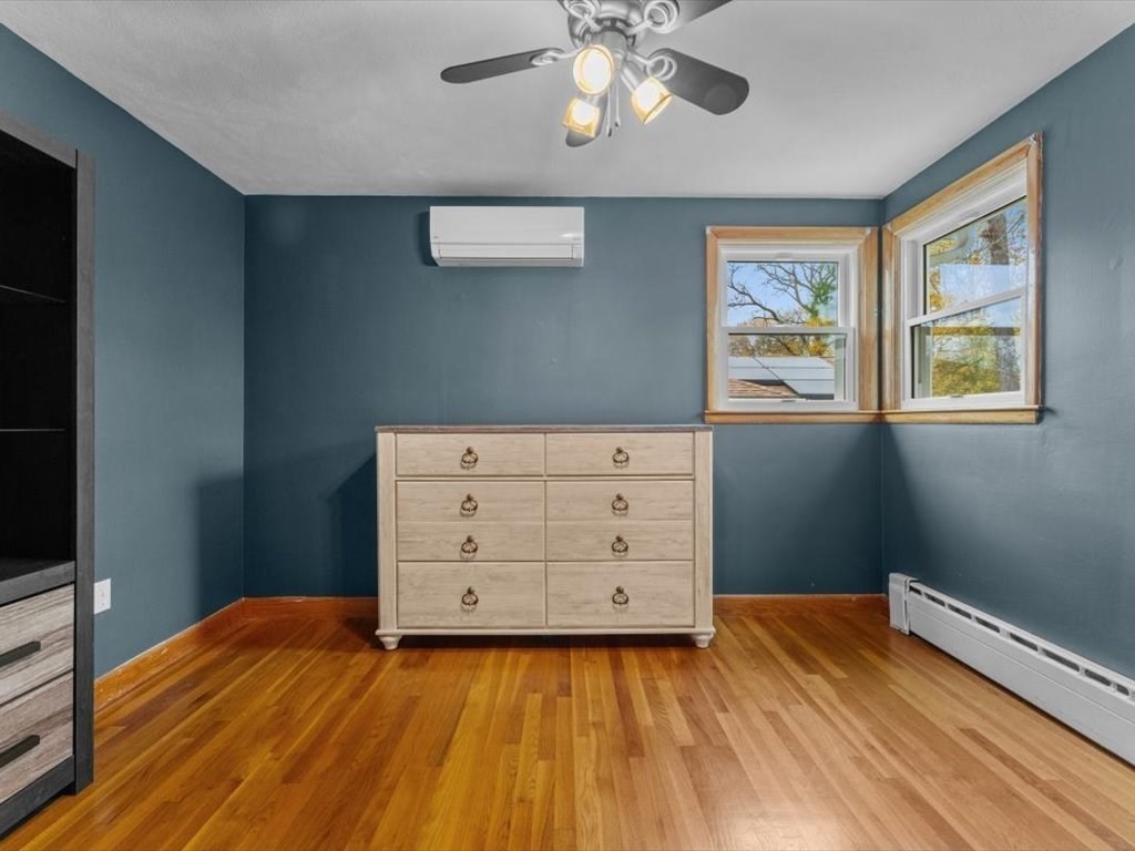 11 Benson Street Worcester, MA 01604 - Photo 20 of 40 a bedroom with a bed and a dresser