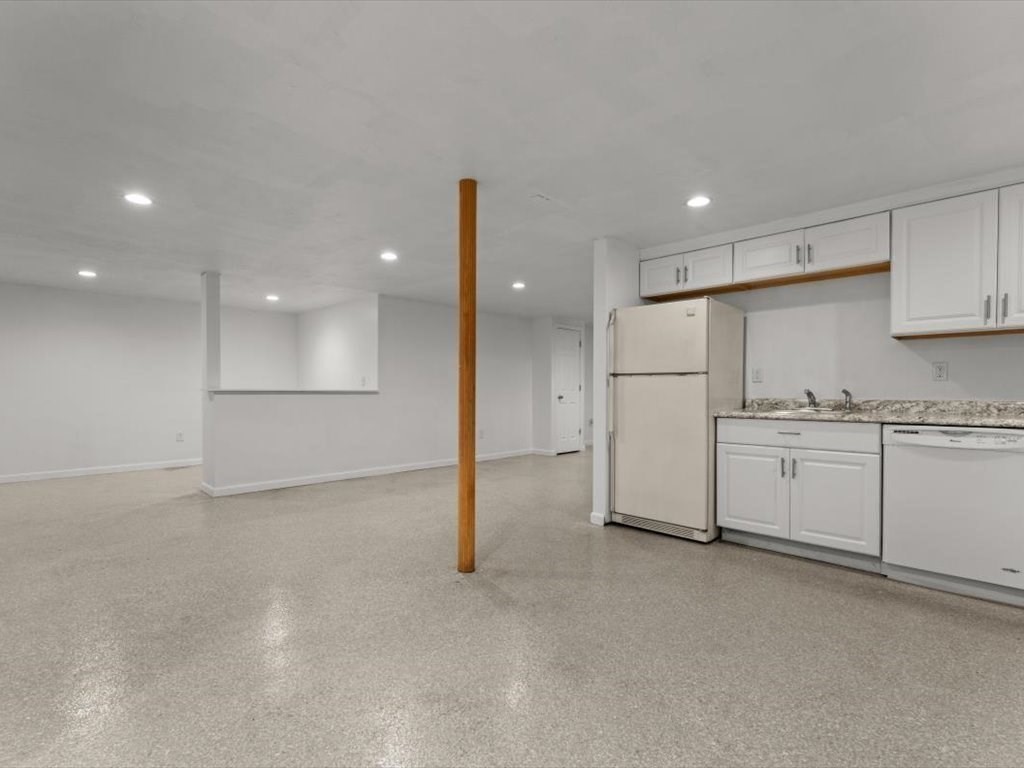 11 Benson Street Worcester, MA 01604 - Photo 28 of 40 a view of a kitchen with white cabinets