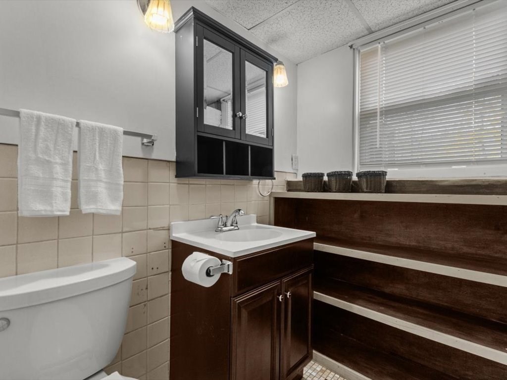 11 Benson Street Worcester, MA 01604 - Photo 32 of 40 a view of a bathroom sink and a window