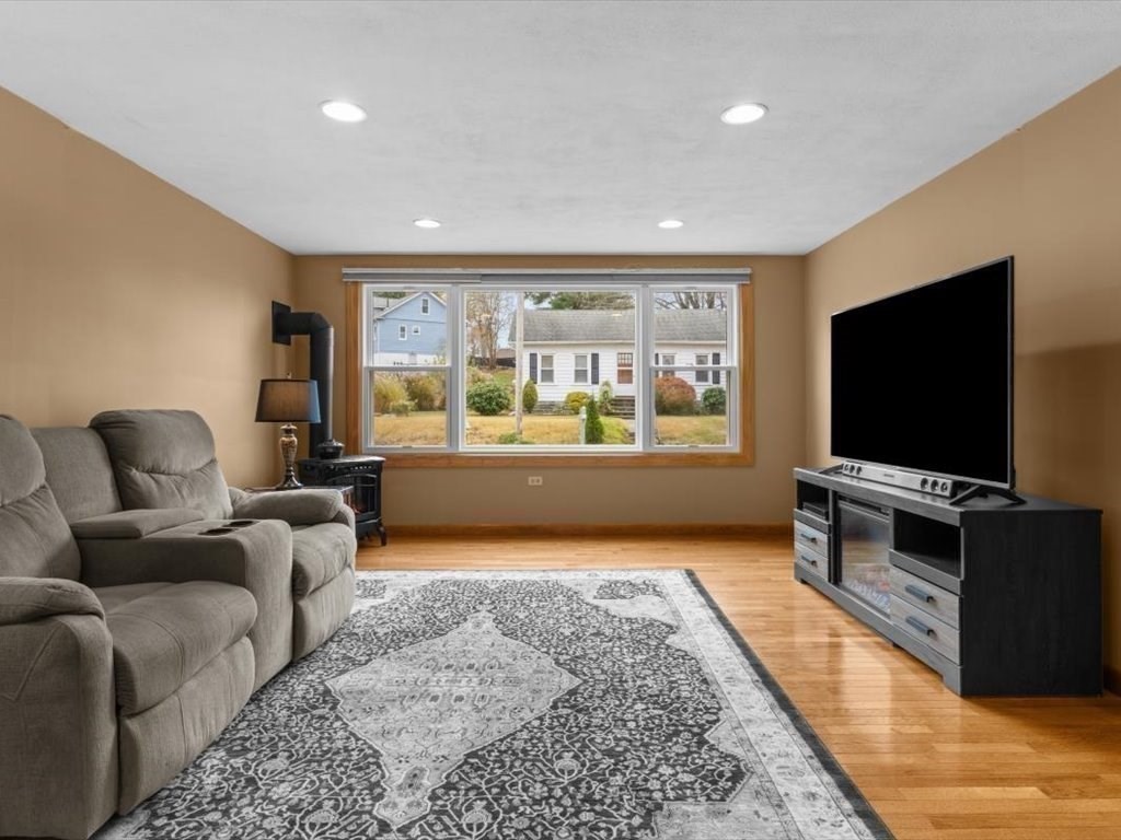 11 Benson Street Worcester, MA 01604 - Photo 7 of 40 a living room with furniture and a flat screen tv
