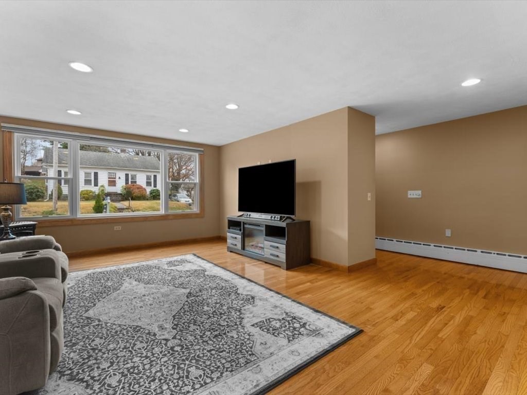 11 Benson Street Worcester, MA 01604 - Photo 8 of 40 a living room with furniture and a flat screen tv