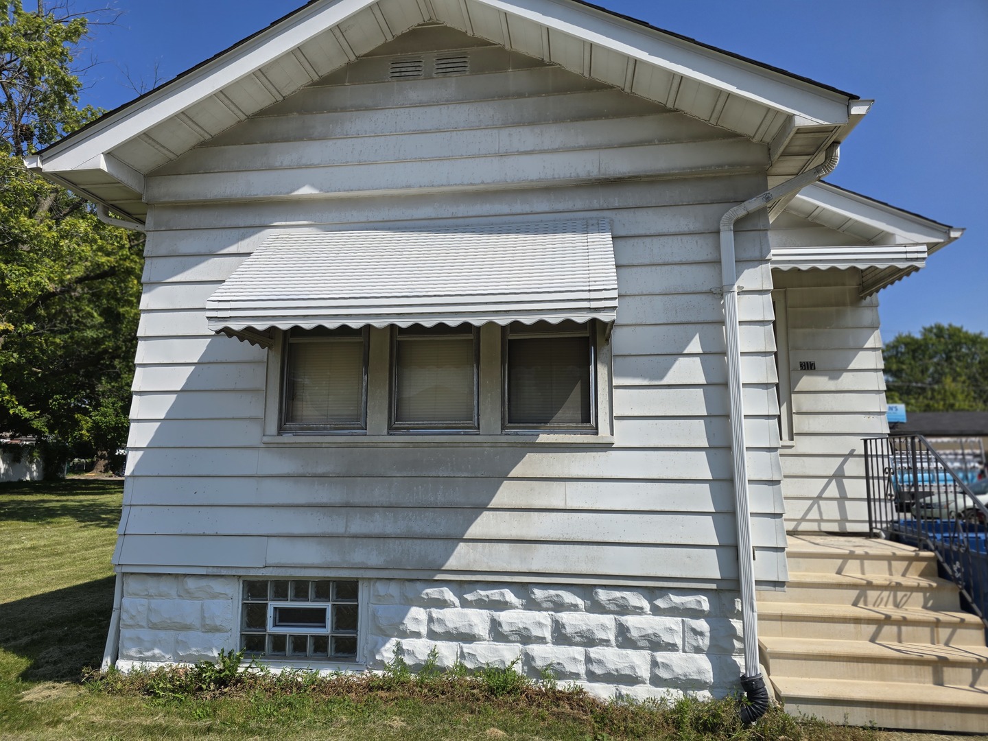 3117 Chicago Road Steger, IL 60475 - Photo 3 of 23 a front view of a house with a yard