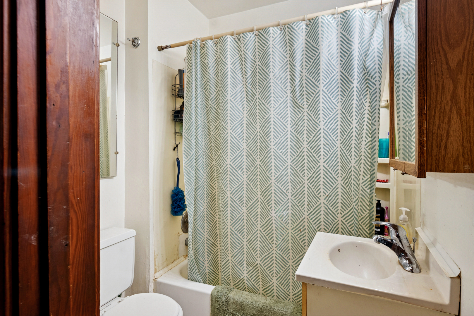 3117 Chicago Road Steger, IL 60475 - Photo 8 of 23 a bathroom with a sink toilet and shower