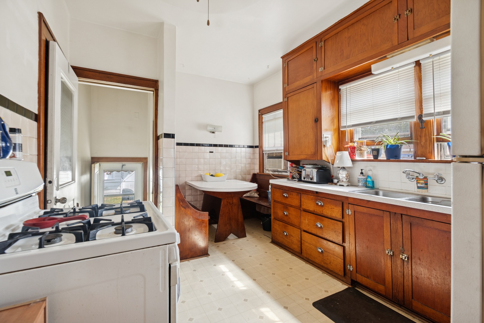 3117 Chicago Road Steger, IL 60475 - Photo 10 of 23 a kitchen with a sink stove and cabinets