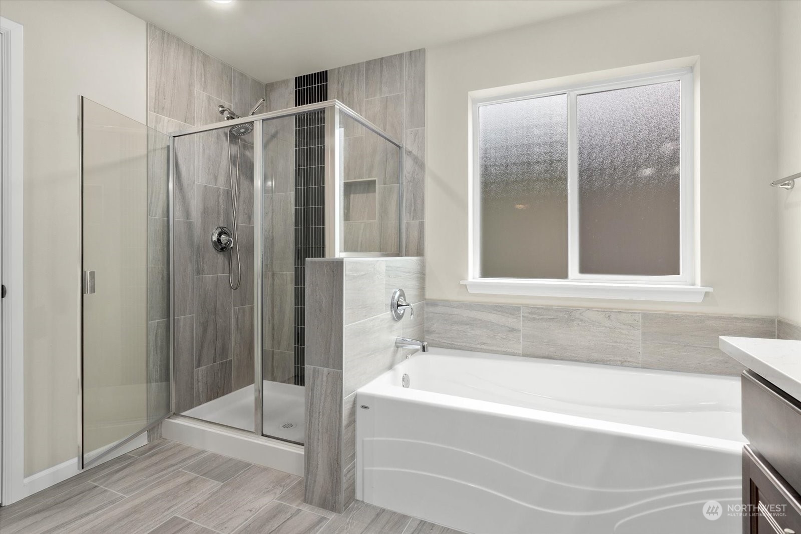 4308 233rd Place Southeast Bothell, WA 98021 - Photo 25 of 39 a bathroom with a bathtub and a shower