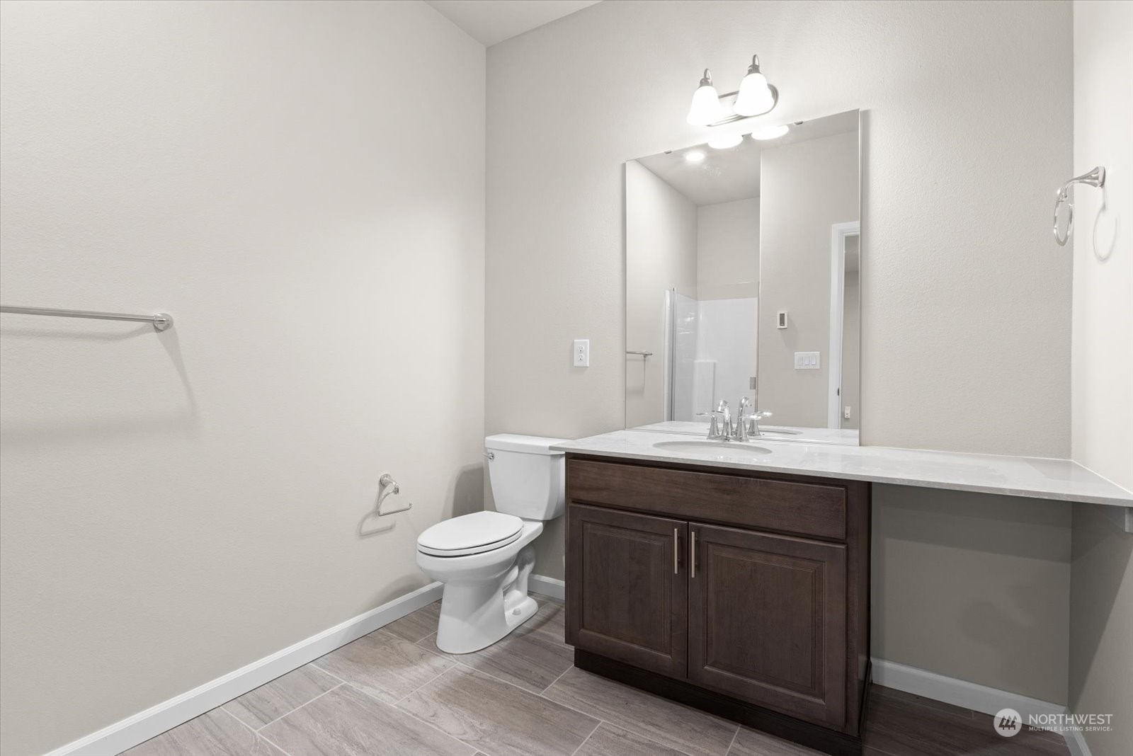 4308 233rd Place Southeast Bothell, WA 98021 - Photo 29 of 39 a bathroom with a sink toilet and a mirror