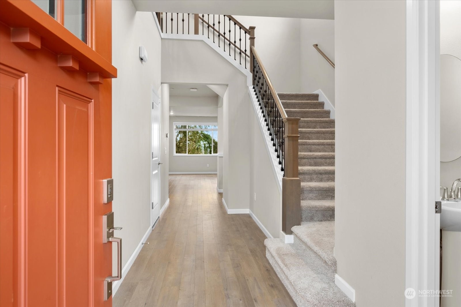4308 233rd Place Southeast Bothell, WA 98021 - Photo 3 of 39 a view of a hallway with wooden floor and staircase