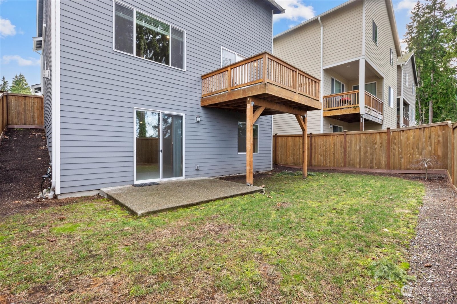 4308 233rd Place Southeast Bothell, WA 98021 - Photo 31 of 39 a view of a house with a yard and wooden fence