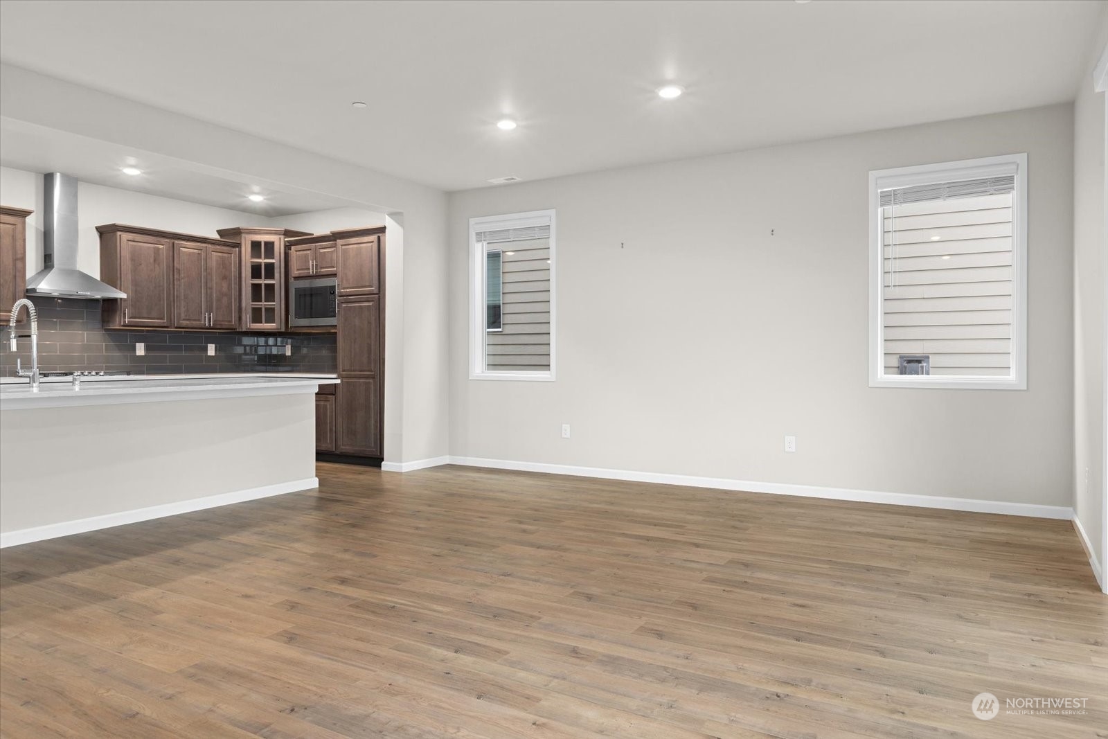 4308 233rd Place Southeast Bothell, WA 98021 - Photo 9 of 39 a view of kitchen with wooden floor and electronic appliances