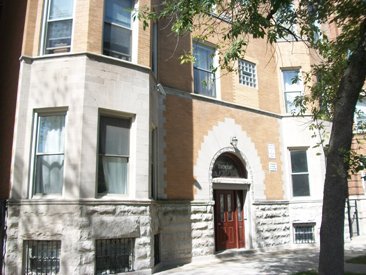 a front view of a house with stairs