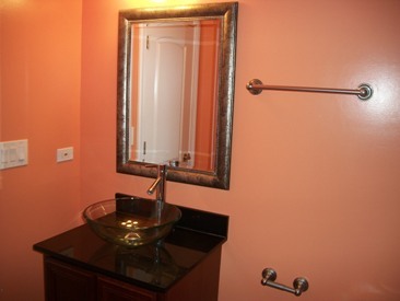 4852 South Prairie Avenue, Unit 1A Chicago, IL 60615 - Photo 12 of 15 a bathroom with a sink and a mirror