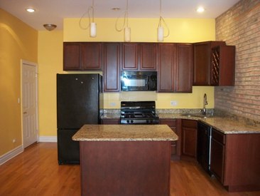 4852 South Prairie Avenue, Unit 1A Chicago, IL 60615 - Photo 6 of 15 a kitchen with stainless steel appliances granite countertop a stove a refrigerator and a sink