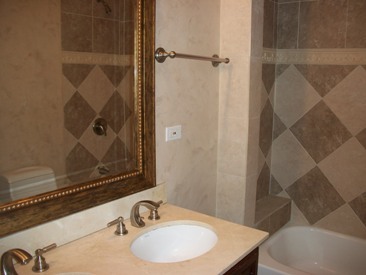4852 South Prairie Avenue, Unit 1A Chicago, IL 60615 - Photo 7 of 15 a bathroom with a sink and a mirror