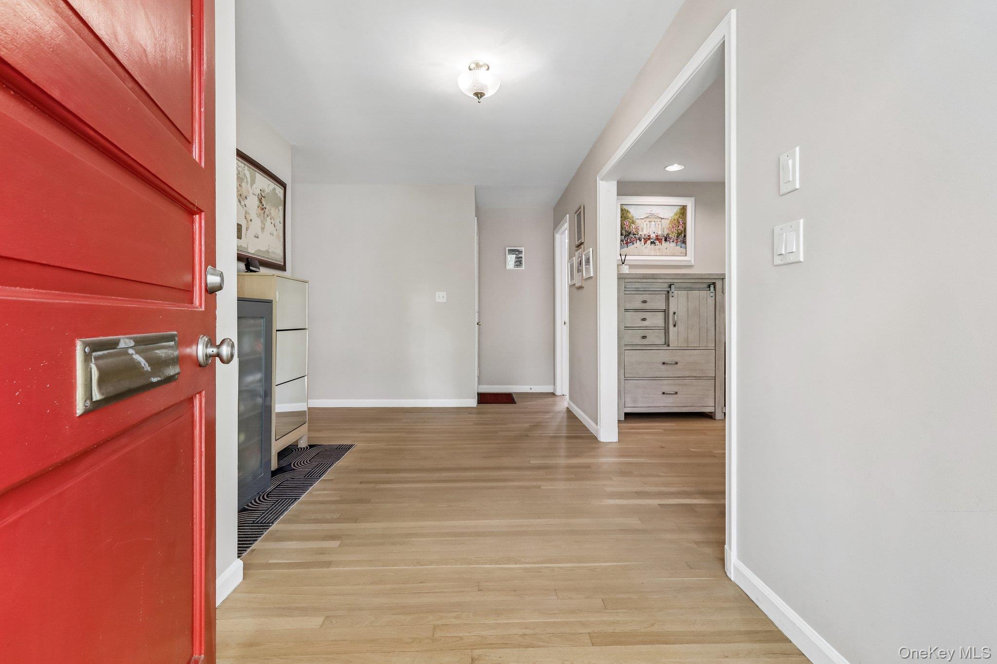 62 Mohegan Road Larchmont, NY 10538 - Photo 7 of 46 a view of a hallway with wooden floor and staircase