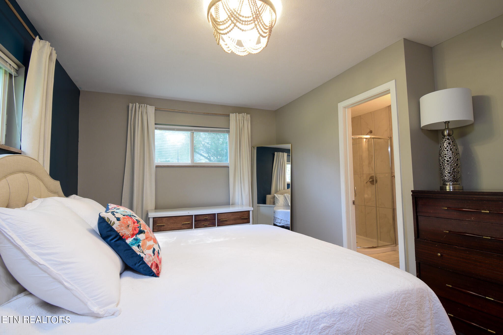 407 Delaware Avenue Oak Ridge, TN 37830 - Photo 15 of 40 a bedroom with a bed and a dresser