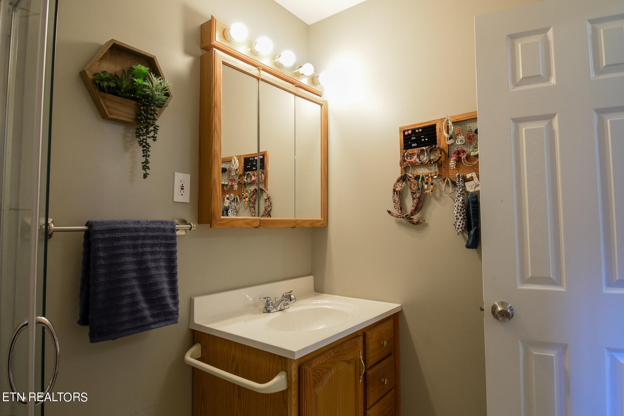 407 Delaware Avenue Oak Ridge, TN 37830 - Photo 20 of 40 a bathroom with a sink and mirror with shower