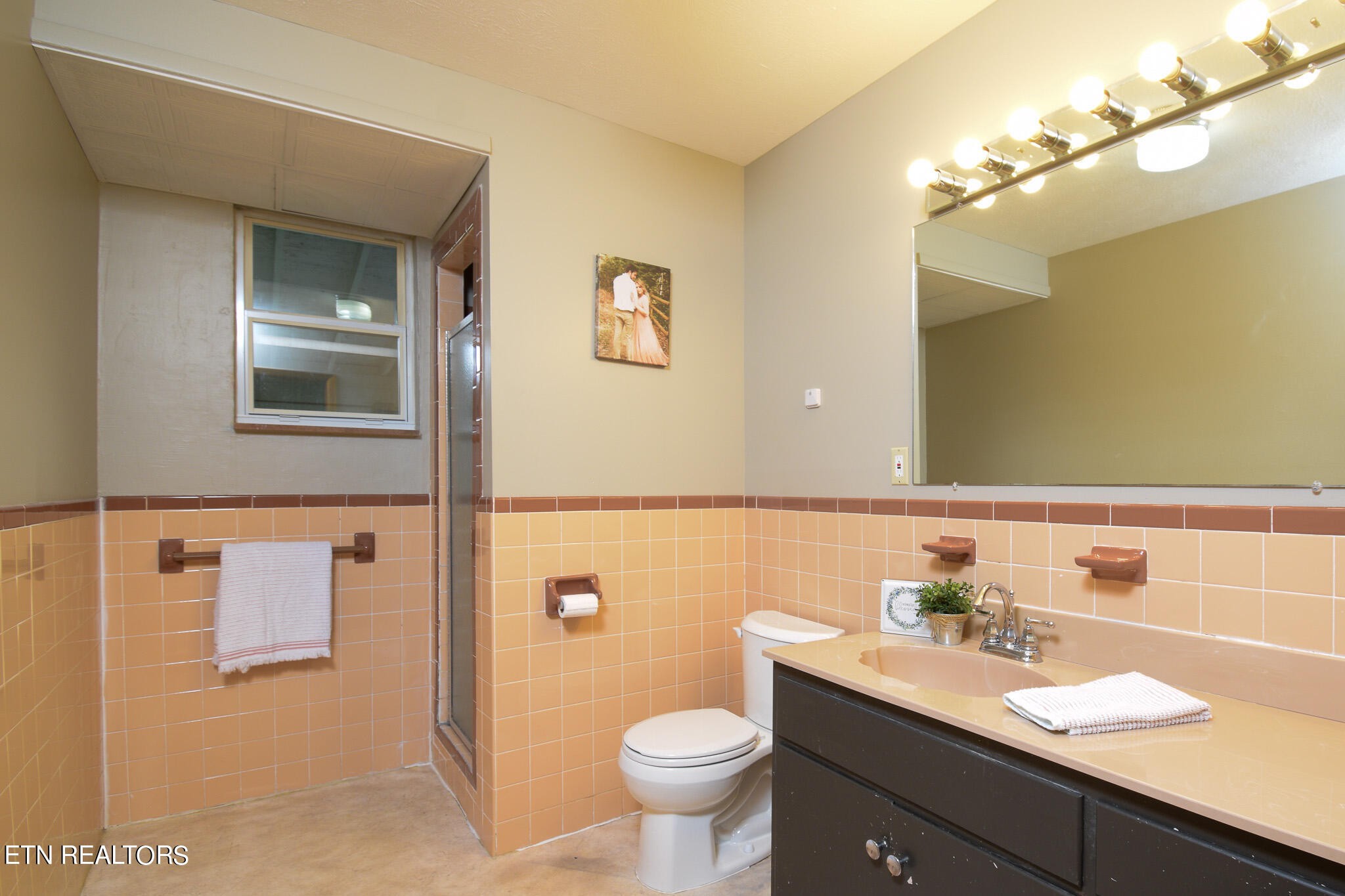 407 Delaware Avenue Oak Ridge, TN 37830 - Photo 25 of 40 a bathroom with a granite countertop sink a mirror and a toilet