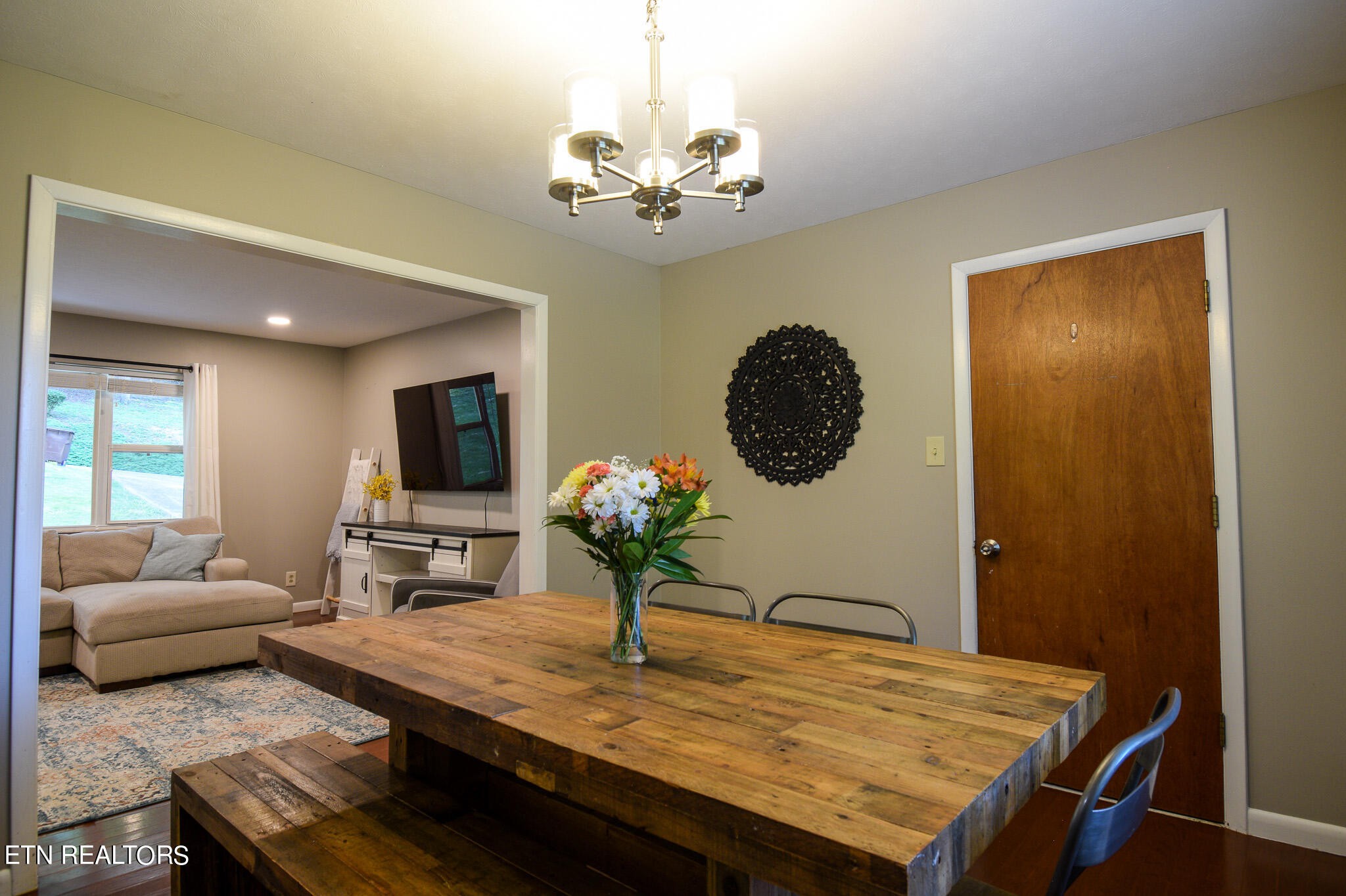 407 Delaware Avenue Oak Ridge, TN 37830 - Photo 6 of 40 a living room with furniture and a chandelier