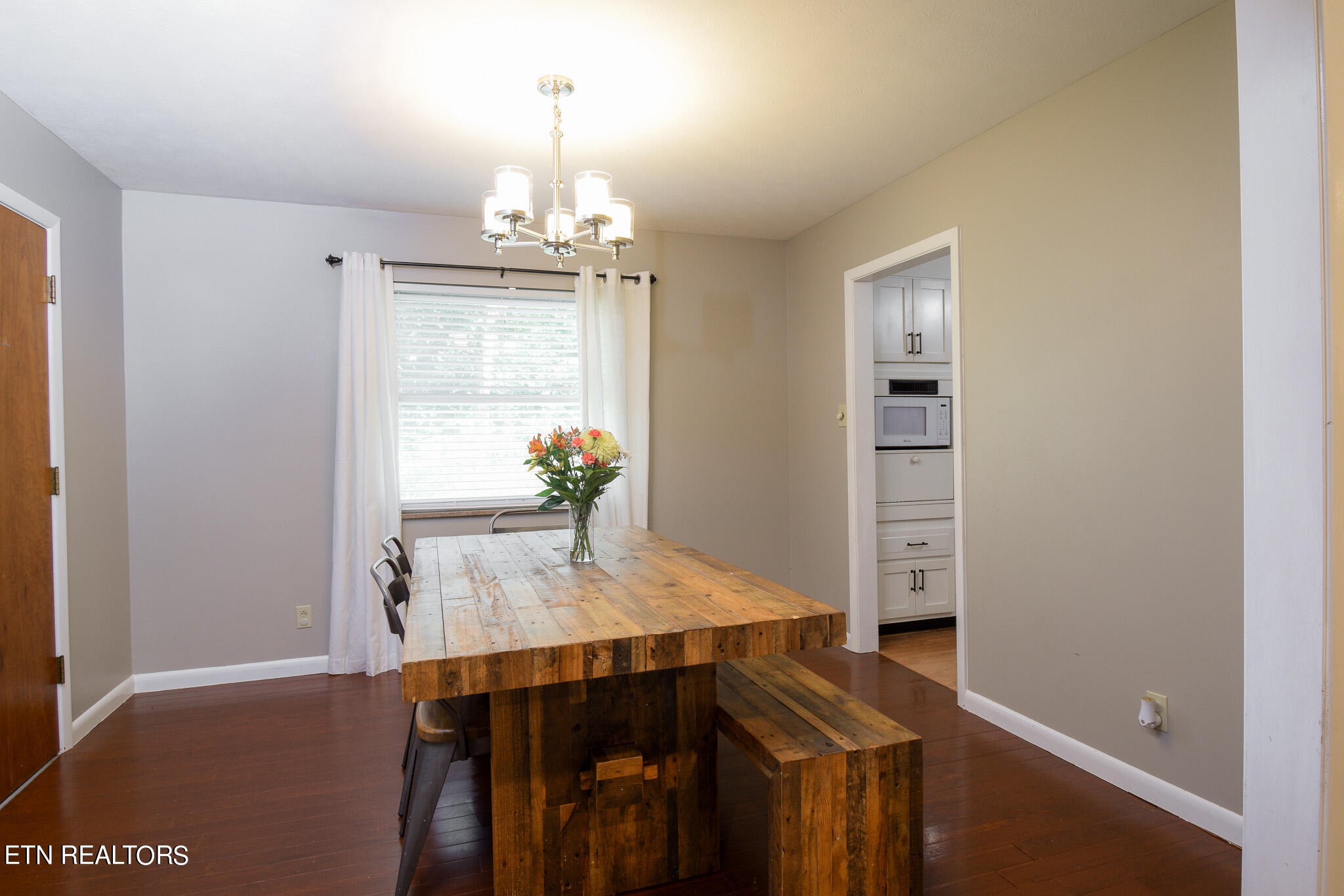 407 Delaware Avenue Oak Ridge, TN 37830 - Photo 7 of 40 a view of a dining room with furniture and wooden floor