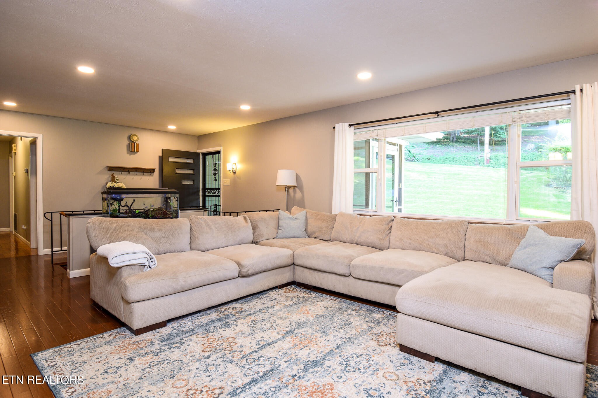 407 Delaware Avenue Oak Ridge, TN 37830 - Photo 8 of 40 a living room with furniture and a large window