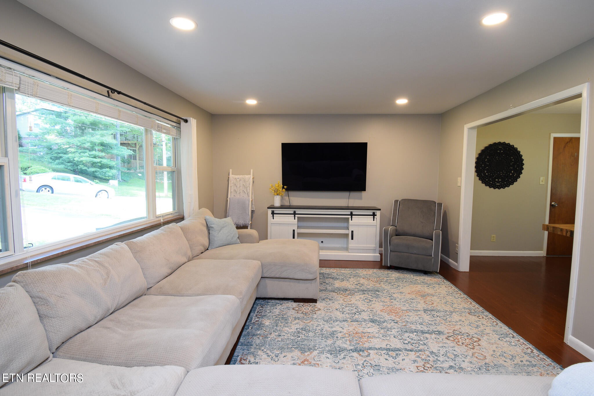 407 Delaware Avenue Oak Ridge, TN 37830 - Photo 10 of 40 a living room with furniture and a flat screen tv