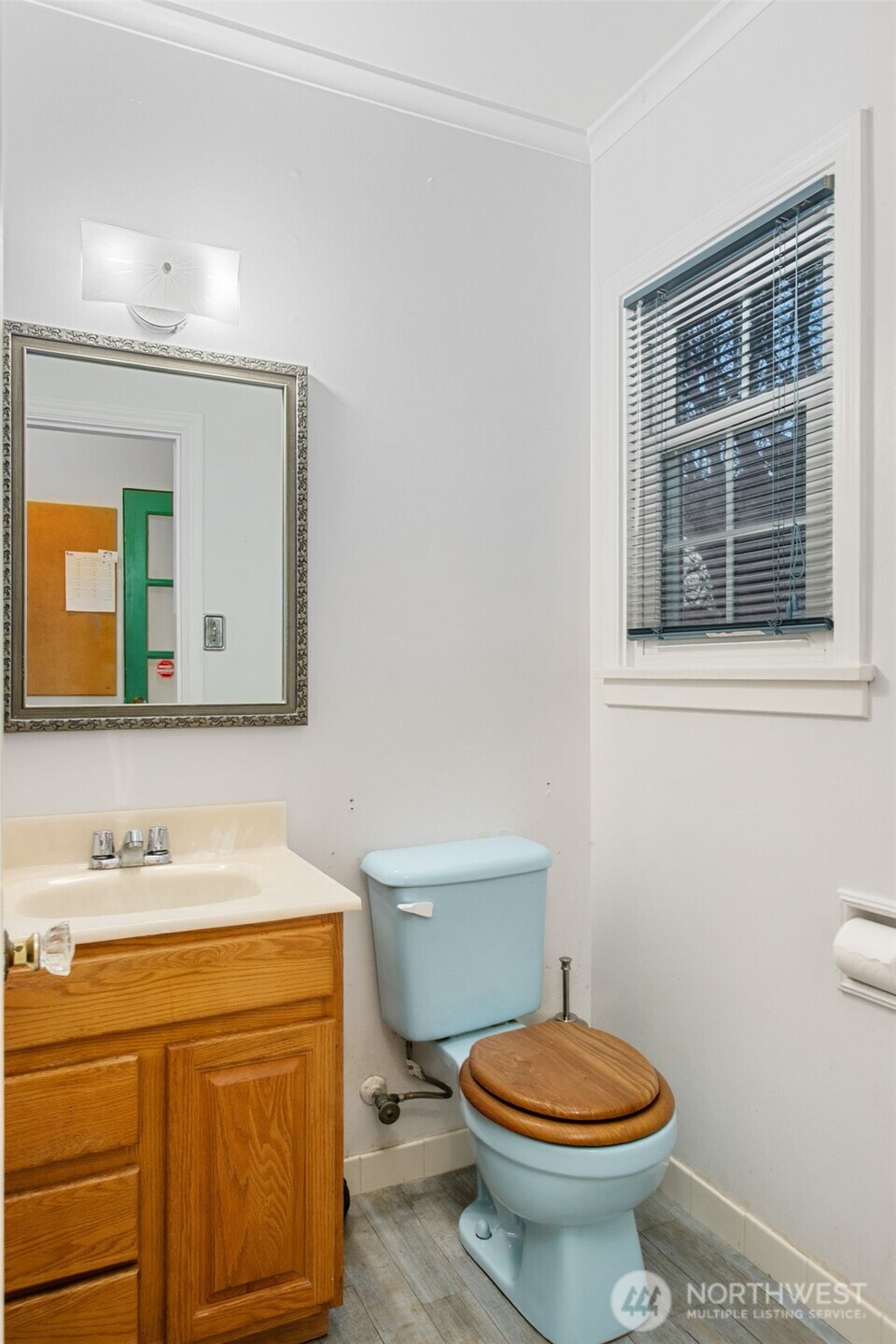 614 1st Avenue Aberdeen, WA 98520 - Photo 15 of 38 a bathroom with a granite countertop toilet sink and mirror