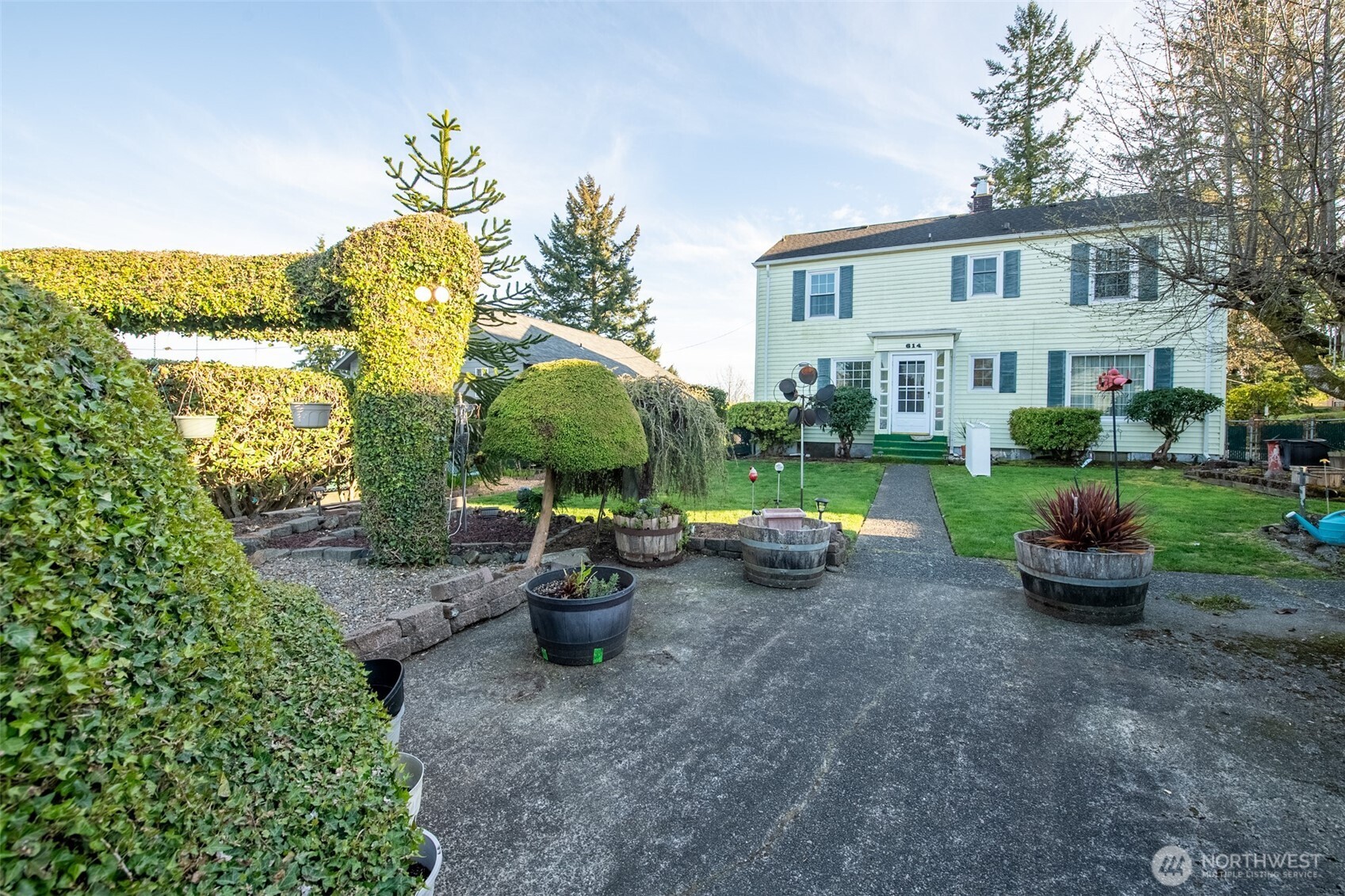 614 1st Avenue Aberdeen, WA 98520 - Photo 31 of 38 a view of a house with backyard sitting area and garden