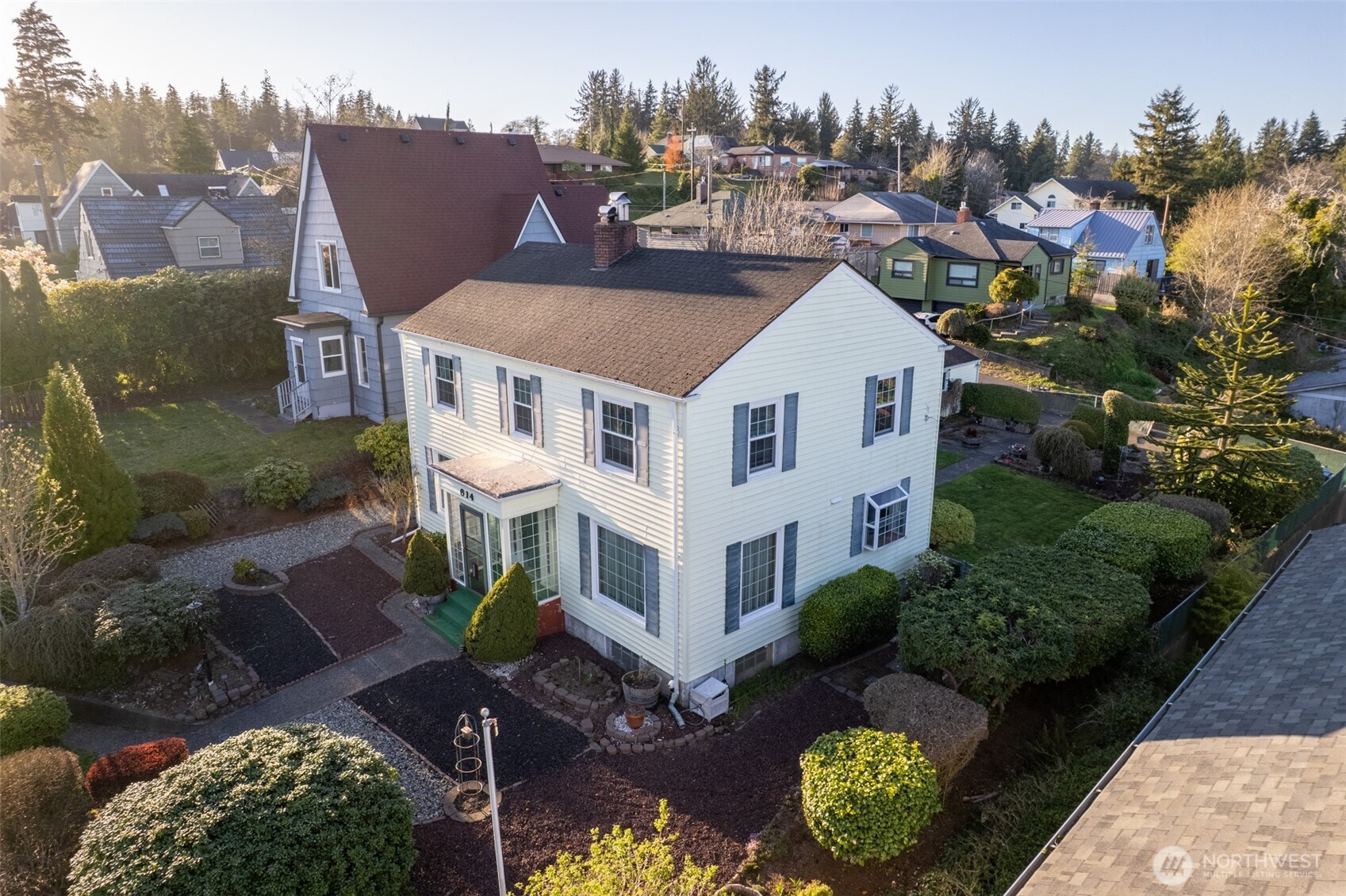 614 1st Avenue Aberdeen, WA 98520 - Photo 35 of 38 a aerial view of a house with a yard and outdoor seating