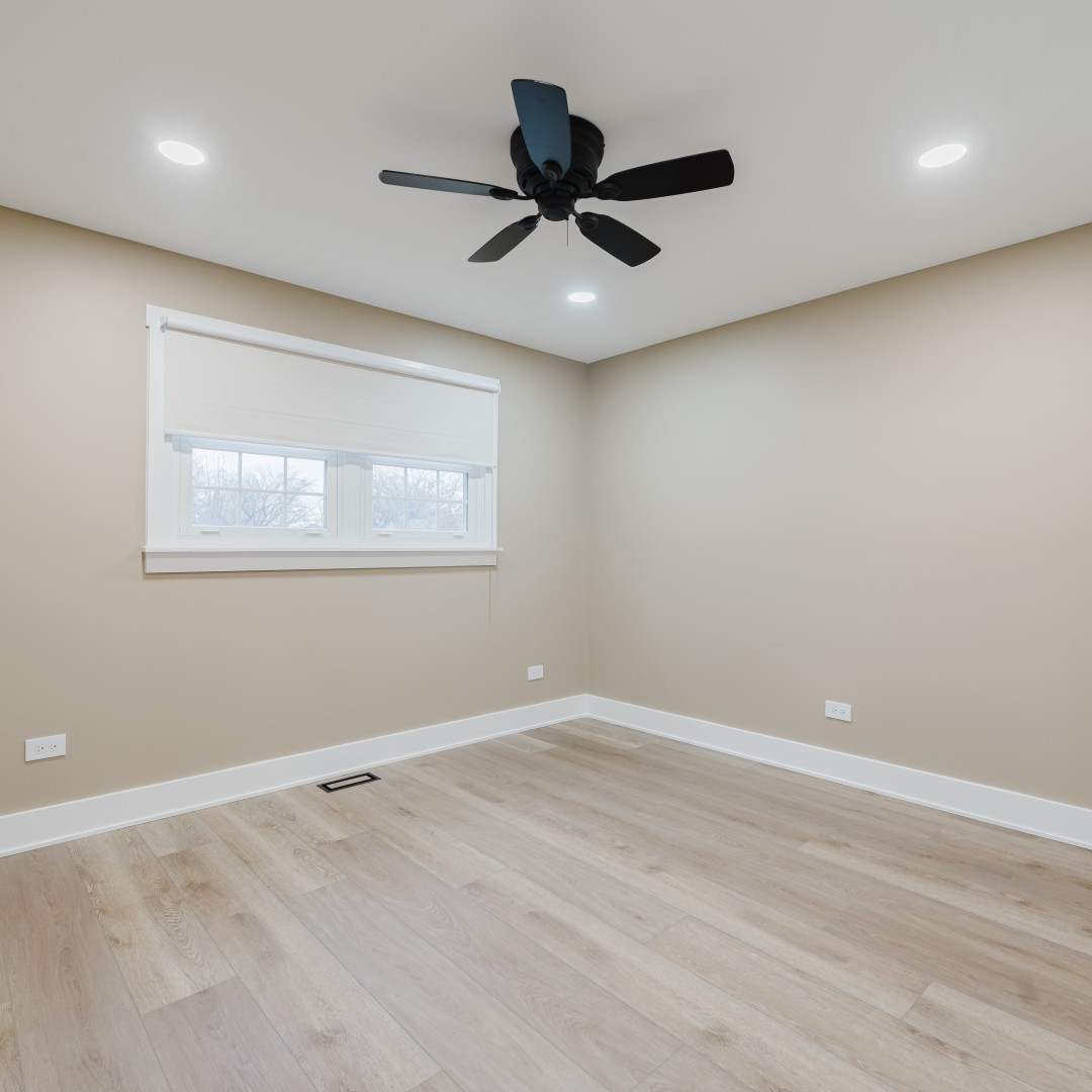 211 Roberts Road New Lenox, IL 60451 - Photo 16 of 37 an empty room with a ceiling fan and window